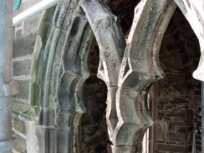 corroded old sandstone tracery windows