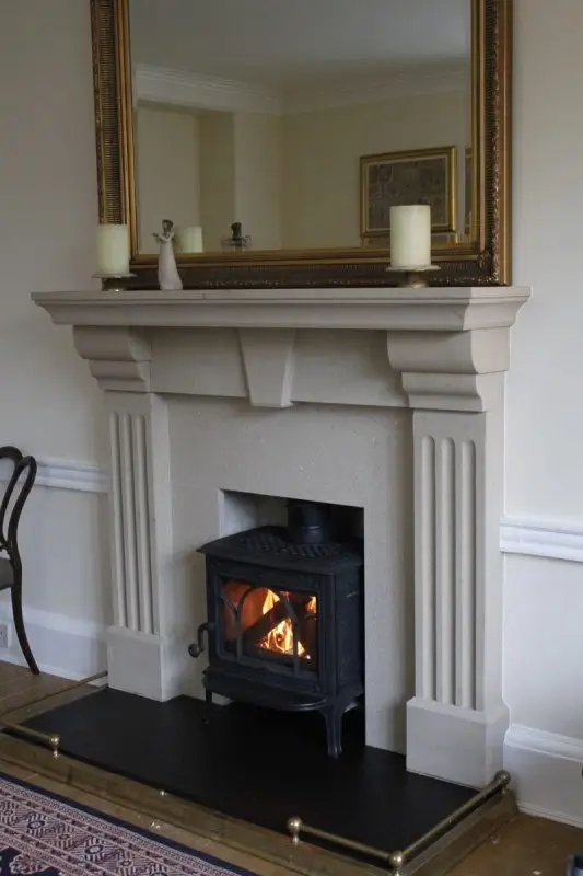 Moulded buff sandstone fireplace